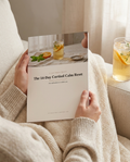 The 14-Day Cortisol Calm Reset held in hand — lifestyle