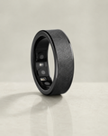 The Insight Ring black wellness tracker on a pale sage background