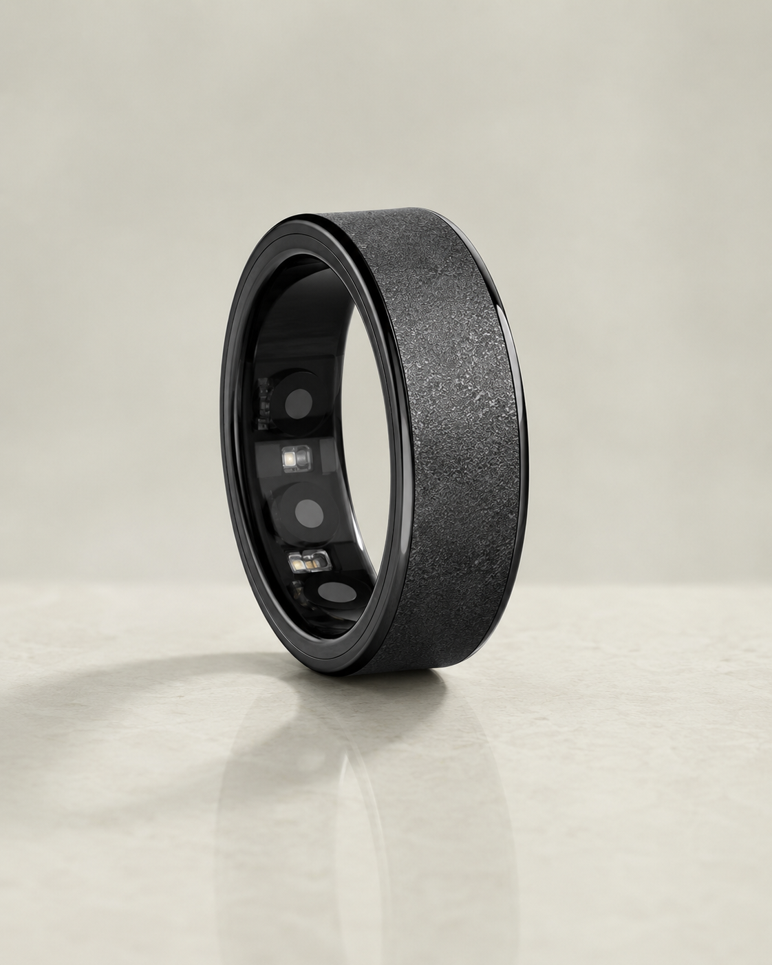 The Insight Ring black wellness tracker on a pale sage background