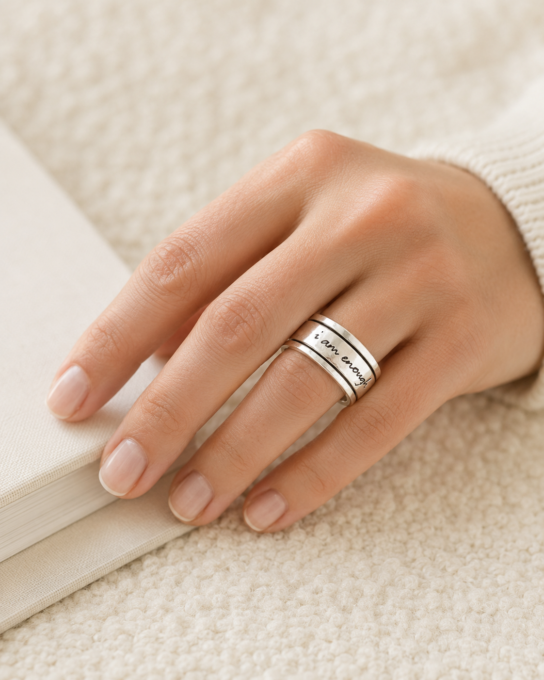 The Calm Ring worn beside a soft journal